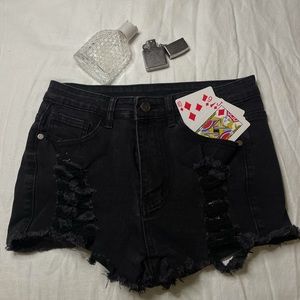 Distressed shaped black shorts